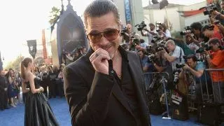 Brad Pitt a primit un pumn in fata pe covorul rosu